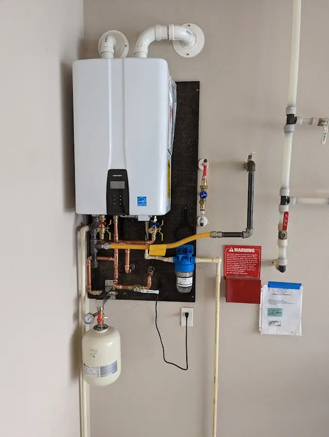 Professional plumber installing copper piping in a Helena Valley Northwest home